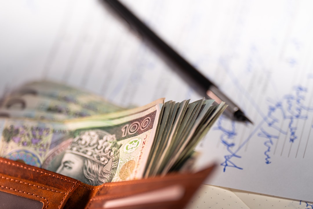 Earnings contract purchase sale wallet cash. Income documentation stack banknotes leather wallet signature transaction ownership transfer finance responsibility planning Europe